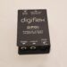 A black Digiflex DPDI passive direct injection box with input and thru jacks, an isolated output, and a switch for pad settings (0 dB and -20 dB). It is placed on a light-colored surface.