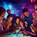 A group of people gathers around a brightly lit interactive table in a lively, colorful environment. They're playing Music Bingo on their smartphones, appearing engaged and entertained. The vibrant scene glows with a playful mix of blue and pink lights.